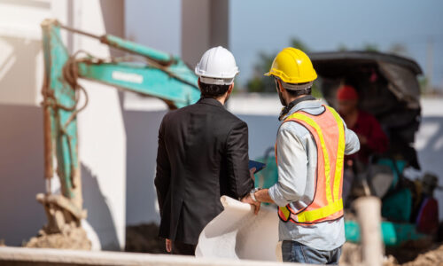 Construction worker and engineer working together on construction site. Construction worker and engineer working together on construction site.